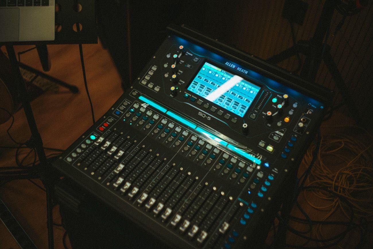 The Allen &amp; Heath SQ6 console glowing in the control room