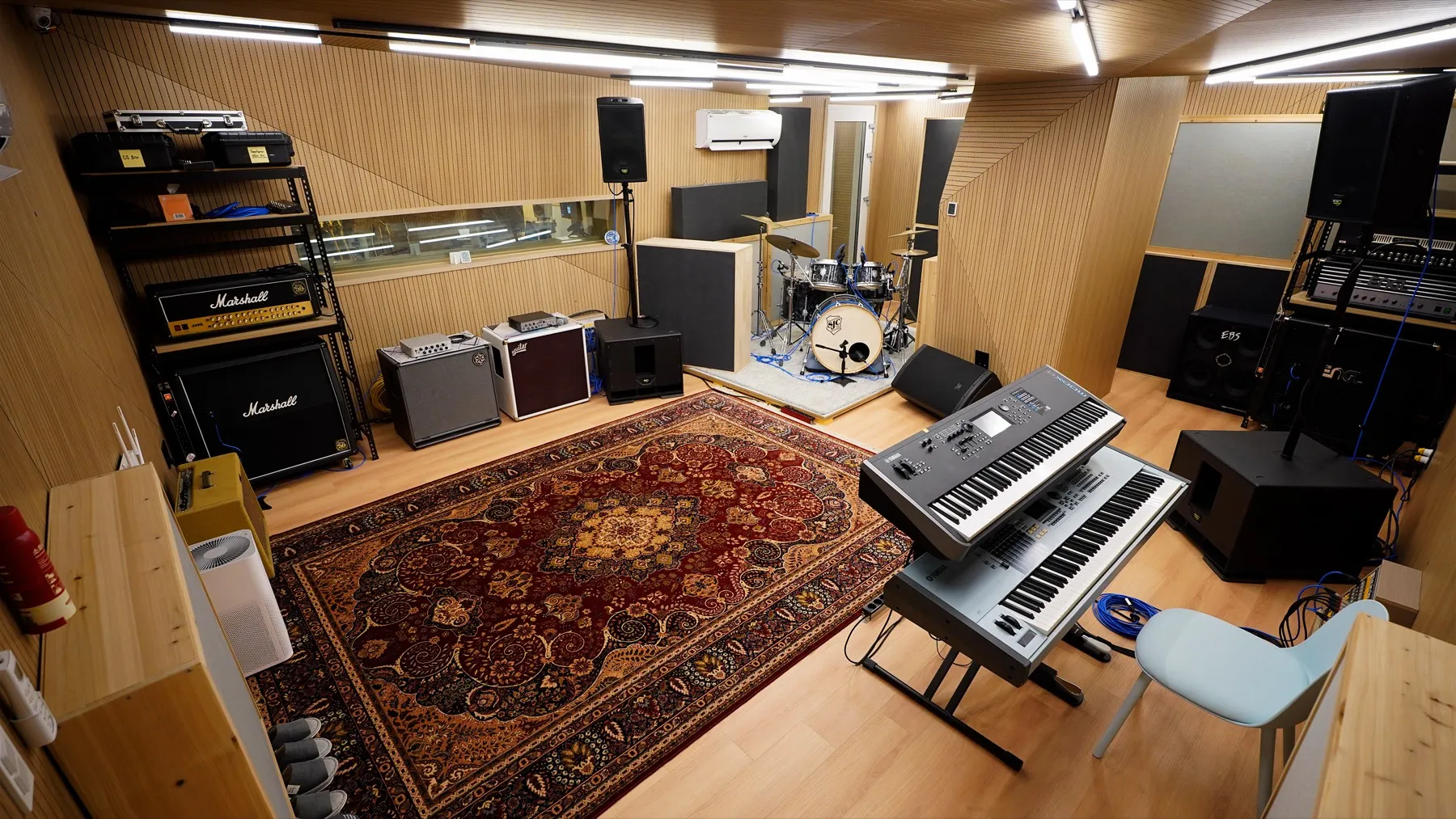 Wide view of the warm wood-panelled live room at Jam in SeouL